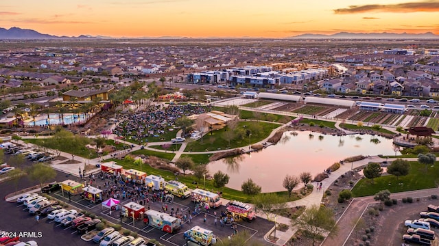 aerial view at dusk with a water and mountain view