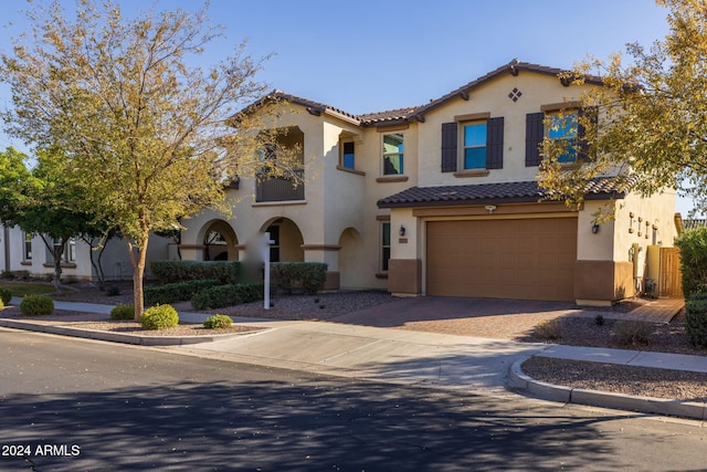 mediterranean / spanish-style home featuring a garage