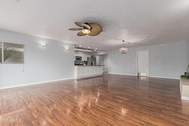 100 E Geneva Dr, Tempe, AZ 85282 - unfurnished living room with dark wood finished floors, a ceiling fan, and baseboards