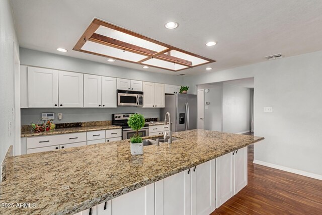 100 E Geneva Dr, Tempe, AZ 85282 - kitchen featuring appliances with stainless steel finishes, a sink, recessed lighting, baseboards, and white cabinetry
