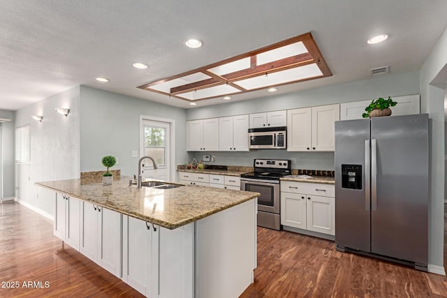 100 E Geneva Dr, Tempe, AZ 85282 - kitchen with appliances with stainless steel finishes, a sink, white cabinets, dark wood finished floors, and recessed lighting