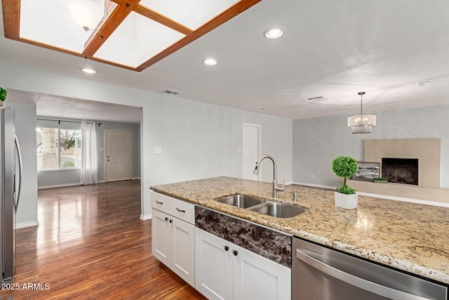 100 E Geneva Dr, Tempe, AZ 85282 - kitchen with appliances with stainless steel finishes, a sink, recessed lighting, white cabinets, and light stone counters