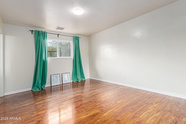 100 E Geneva Dr, Tempe, AZ 85282 - unfurnished room with wood finished floors and baseboards