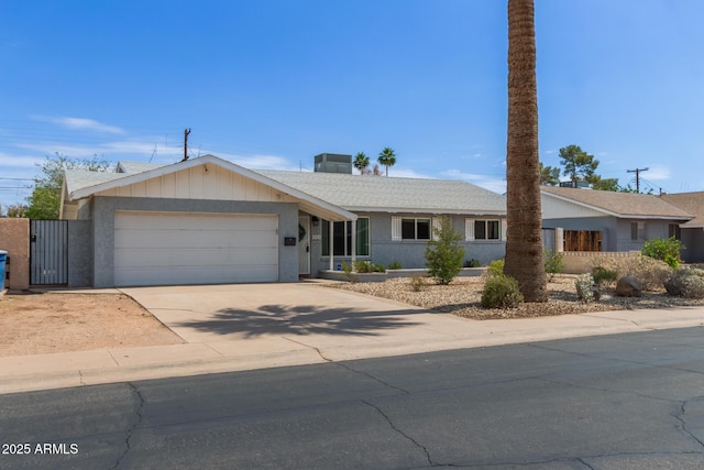 100 E Geneva Dr, Tempe, AZ 85282 - ranch-style house with a garage, driveway, stucco siding, and a gate