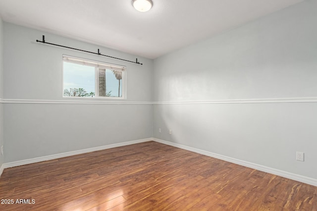 100 E Geneva Dr, Tempe, AZ 85282 - unfurnished room with wood finished floors and baseboards