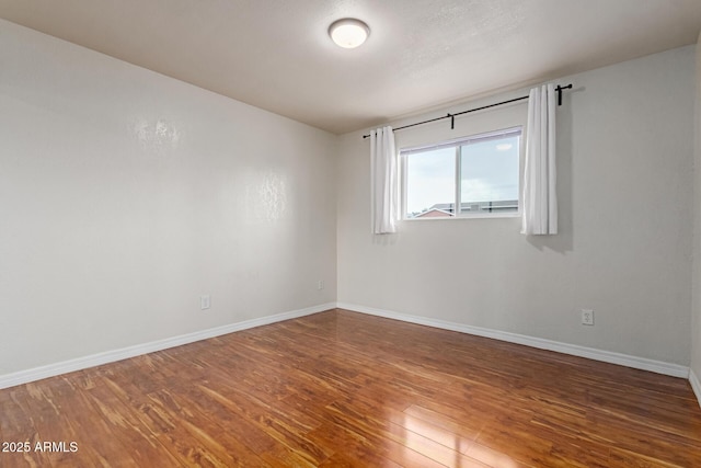 100 E Geneva Dr, Tempe, AZ 85282 - spare room featuring wood finished floors and baseboards