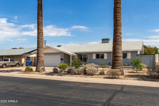 100 E Geneva Dr, Tempe, AZ 85282 - single story home featuring an attached garage, concrete driveway, stucco siding, and fence