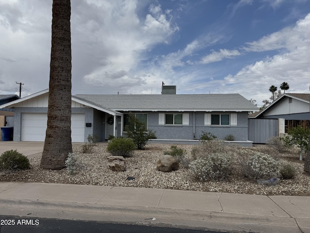 100 E Geneva Dr, Tempe, AZ 85282 - ranch-style home with driveway, an attached garage, stucco siding, and roof with shingles