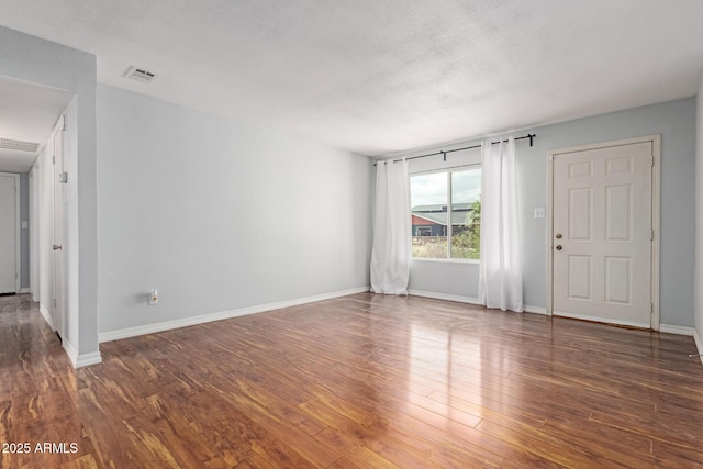 100 E Geneva Dr, Tempe, AZ 85282 - empty room featuring wood finished floors and baseboards