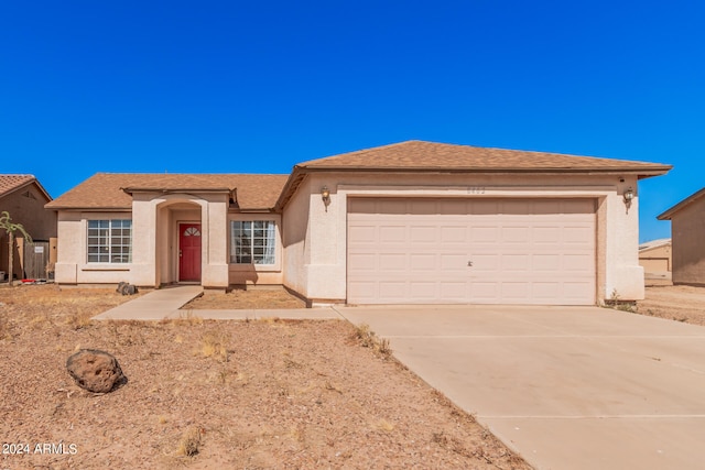 ranch-style home featuring a garage