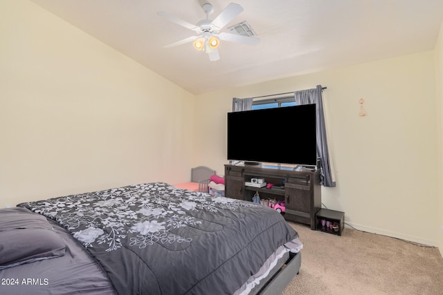 carpeted bedroom featuring vaulted ceiling and ceiling fan