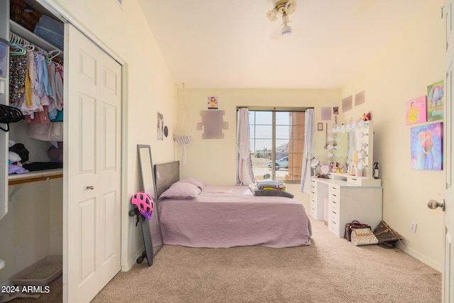 carpeted bedroom with a closet