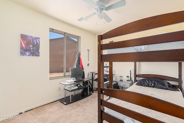 carpeted bedroom with ceiling fan and lofted ceiling