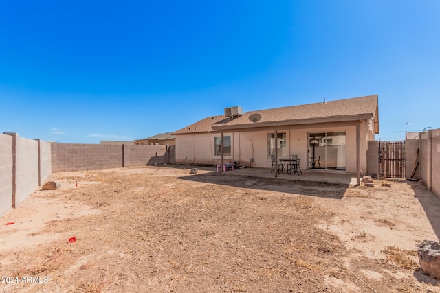 rear view of property featuring a patio area