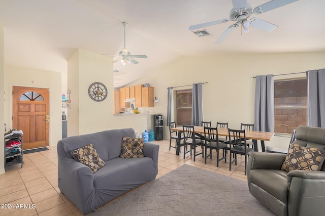 tiled living room with ceiling fan and vaulted ceiling