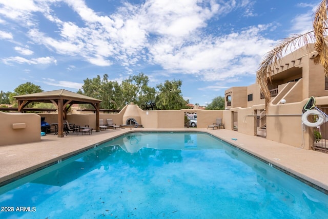 view of pool featuring a gazebo and a patio area