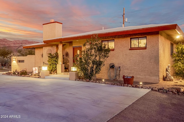 view of front of property featuring a patio