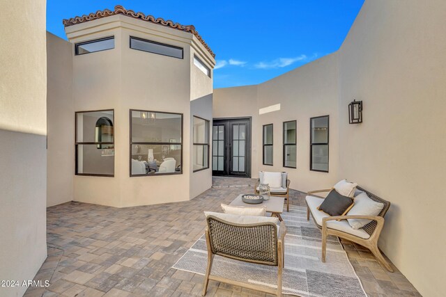 3800 E Lincoln Dr Unit 42, Phoenix, AZ 85018 - view of patio featuring french doors and an outdoor living space