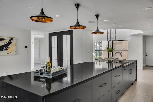 3800 E Lincoln Dr Unit 42, Phoenix, AZ 85018 - kitchen with dark countertops, a sink, recessed lighting, decorative light fixtures, and gray cabinetry