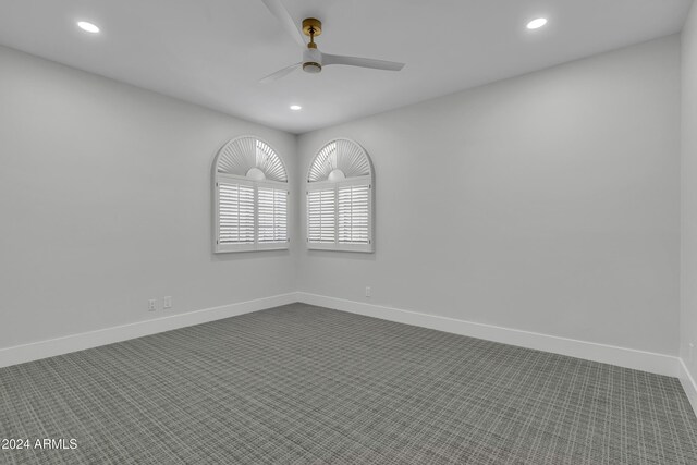3800 E Lincoln Dr Unit 42, Phoenix, AZ 85018 - spare room featuring recessed lighting, ceiling fan, dark carpet, and baseboards