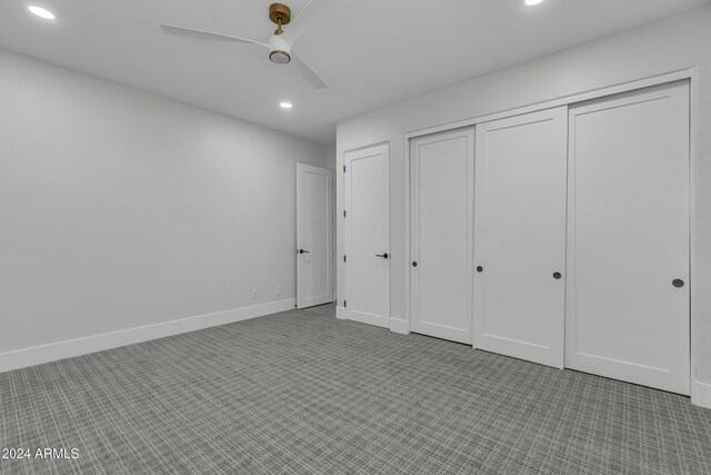 3800 E Lincoln Dr Unit 42, Phoenix, AZ 85018 - unfurnished bedroom with recessed lighting, carpet flooring, a closet, ceiling fan, and baseboards