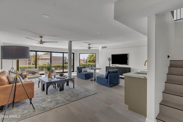3800 E Lincoln Dr Unit 42, Phoenix, AZ 85018 - living area with a ceiling fan, stairway, and recessed lighting