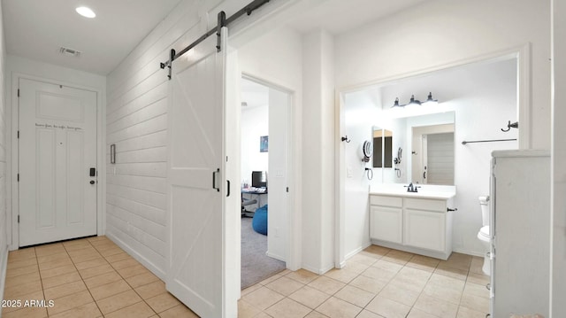 bathroom featuring tile patterned floors, vanity, and toilet