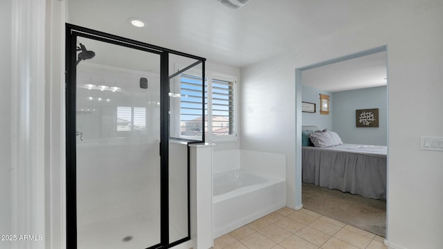 bathroom featuring tile patterned flooring and independent shower and bath