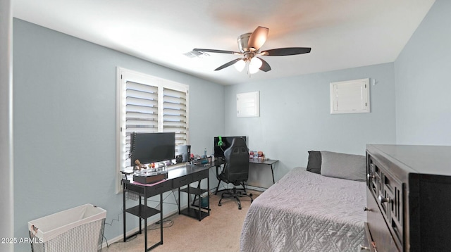 bedroom featuring light colored carpet and ceiling fan