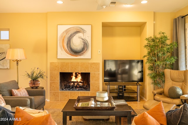 living room featuring a fireplace and light tile patterned floors