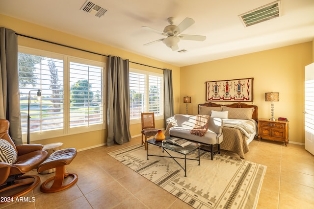 tiled bedroom with ceiling fan