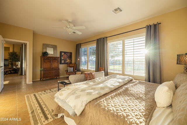 bedroom with light tile patterned floors and ceiling fan