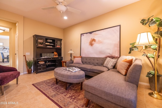 living room with ceiling fan and light tile patterned floors