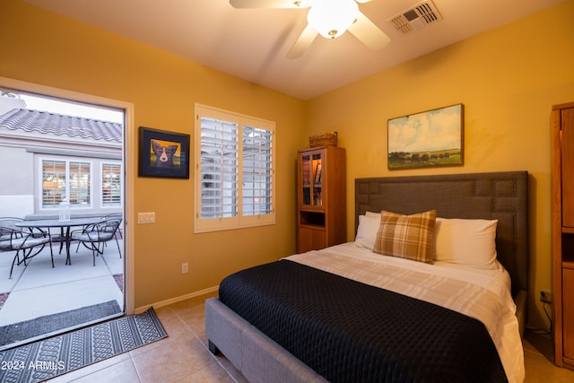 tiled bedroom with ceiling fan