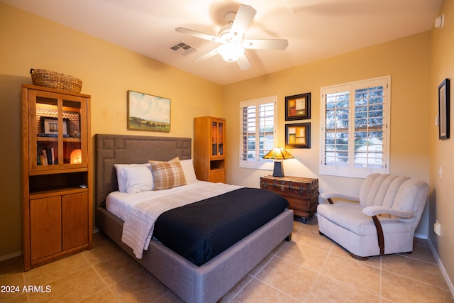 tiled bedroom with ceiling fan