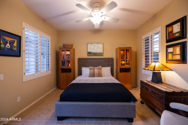 bedroom with tile patterned flooring and ceiling fan