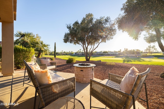 view of patio featuring an outdoor living space with a fire pit