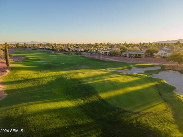 surrounding community featuring a yard and a mountain view