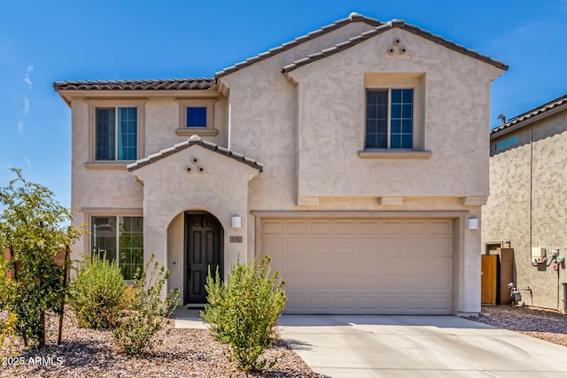 mediterranean / spanish-style house featuring a garage