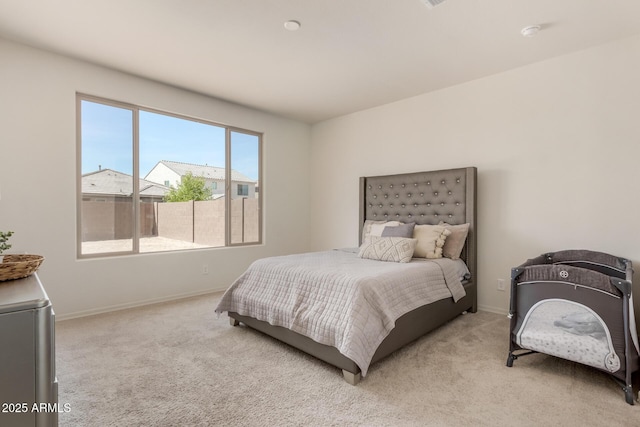 bedroom with light carpet