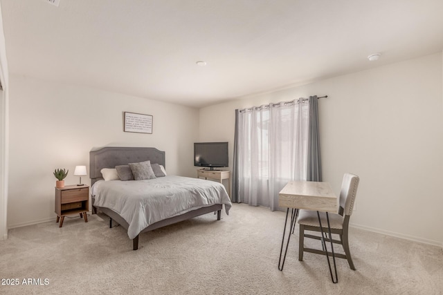 bedroom featuring light colored carpet