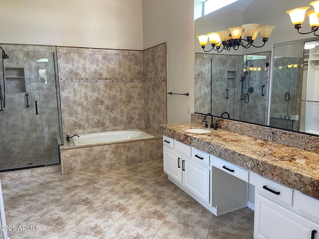 bathroom with a garden tub, tile patterned flooring, a stall shower, and vanity