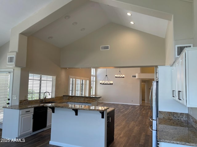 kitchen featuring a sink, high vaulted ceiling, visible vents, and dishwasher