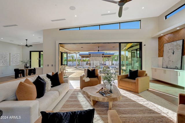 living room with lofted ceiling and light wood-type flooring