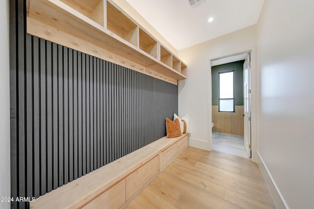 mudroom with light hardwood / wood-style floors