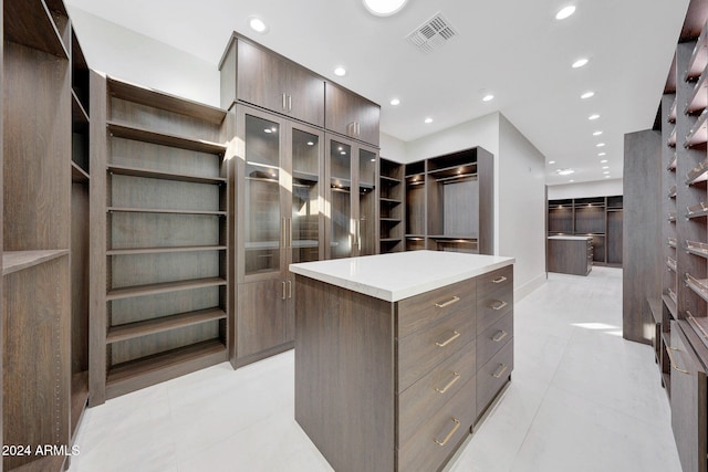 spacious closet featuring light tile patterned floors