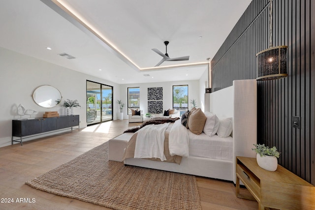 bedroom with access to outside and light hardwood / wood-style flooring