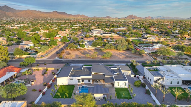 birds eye view of property with a mountain view