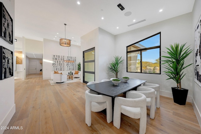 dining room with light hardwood / wood-style flooring