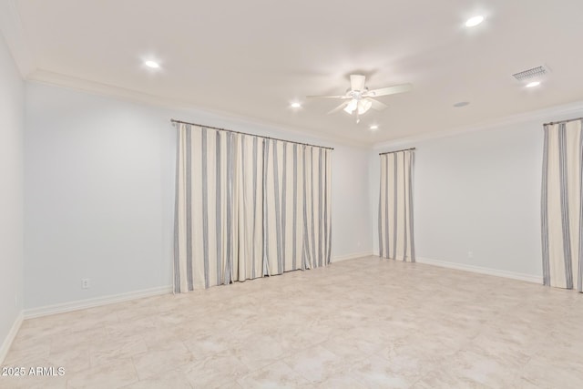 empty room with ceiling fan and crown molding